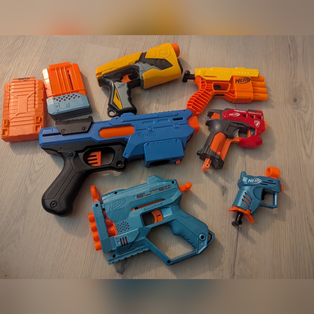 6 total toy Nerf guns and 2 magazines